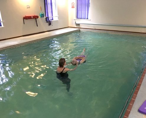 Frances, 82 years, performing back crawl leg kick and a back star float - previously Frances was a non-swimmer, very nervous and scared of the water