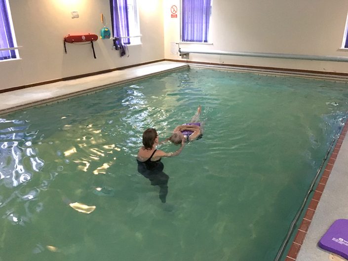 Frances, 82 years, performing back crawl leg kick and a back star float - previously Frances was a non-swimmer, very nervous and scared of the water