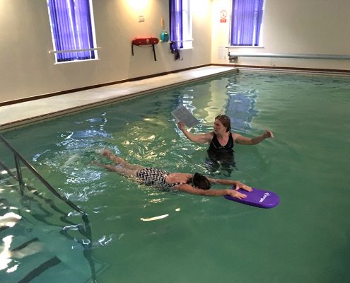 Bernadette performing Front Crawl leg kick....previously Bernadette was unable to put her face into the water and exhale